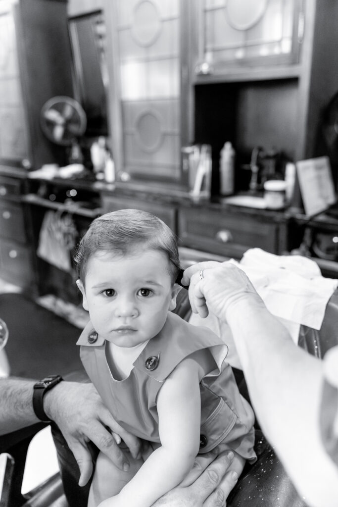 Tiffany Bradley, a Savannah Family Photographer, snaps a picture of her son during his first haircut.