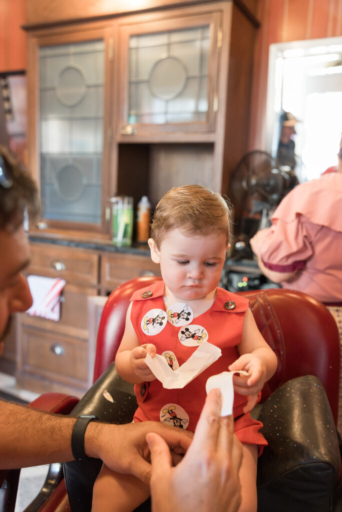 Covered in stickers, Savannah family photographer Tiffany Bradley's son waits for his haircut to be over.