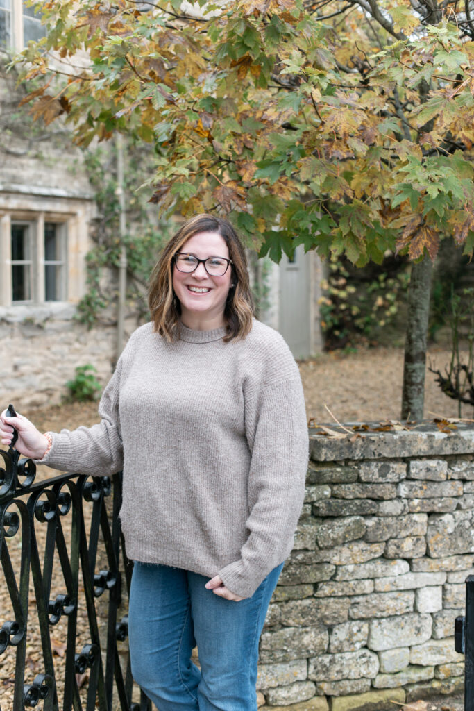 Tiffany Bradley in front of a cottage in Bibury.