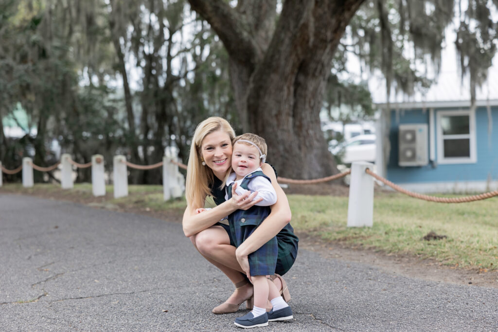 A mama and her little boy matching in plaid Beaufort Bonnet company outfits stop for a smile during their Isle of Hope session.