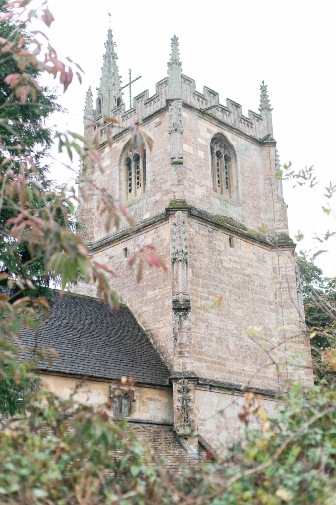 The back view of the top of St. Andrew's Church in Castle Combe, England.