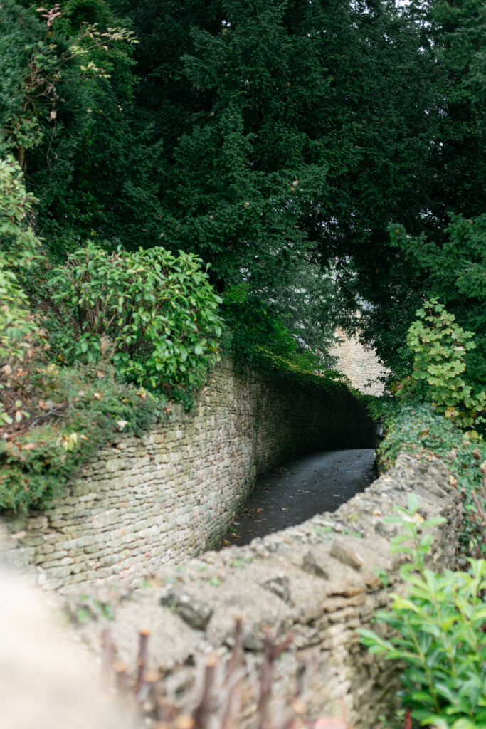 Stone walls on either side of a road.