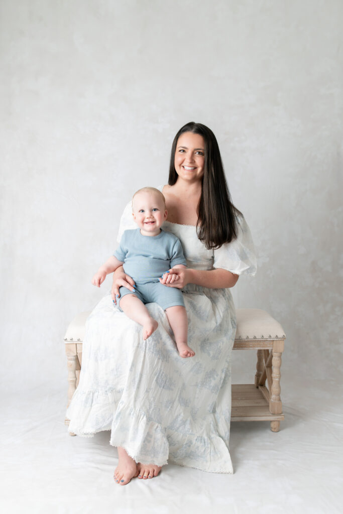 A mom and her one-year-old son, smile for the camera during their Savannah photography session. 