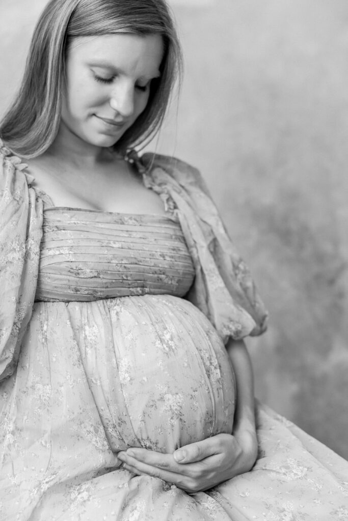 Maternity dress up close to bump friendly dress in maternity photo shoot 
