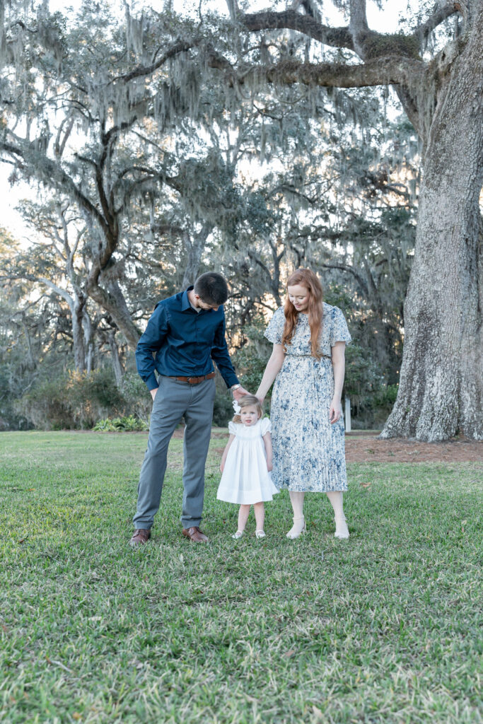 Family of three during a fall session at HollyOaks on the Marsh with Savannah, GA photographer Tiffany Bradley Photography.