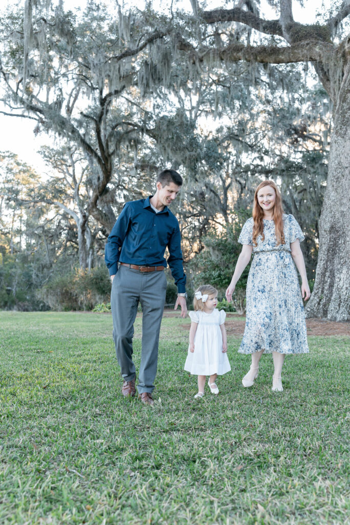 Tiffany Bradley Photography family portrait at HollyOaks on the Marsh featuring a mom, dad, and toddler daughter.