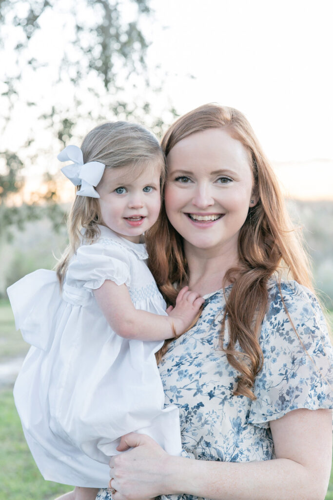 Mom and daughter smile at the camera during their family session with Savannah photographer Tiffany Bradley.