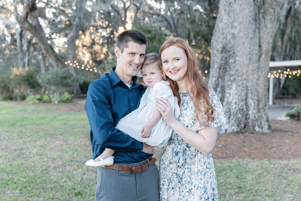 Family of three during a fall session at HollyOaks on the Marsh with Tiffany Bradley Photography.