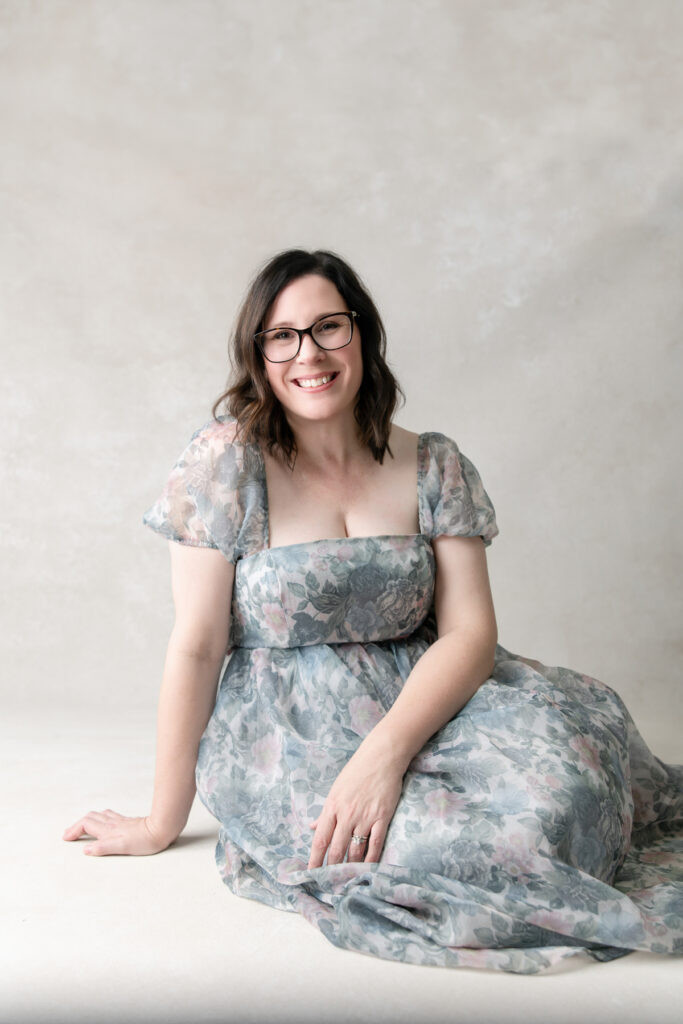 Savannah maternity photographer Tiffany Bradley poses in a dress from her complimentary client closet in a studio portrait session.