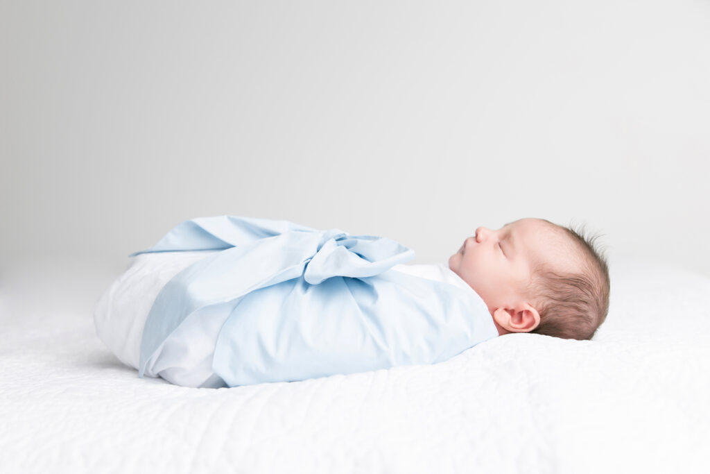 Newborn photography gallery in Savannah, GA showcasing baby portraits, parent and family images, fine art canvas artwork, and soft white studio portraits.