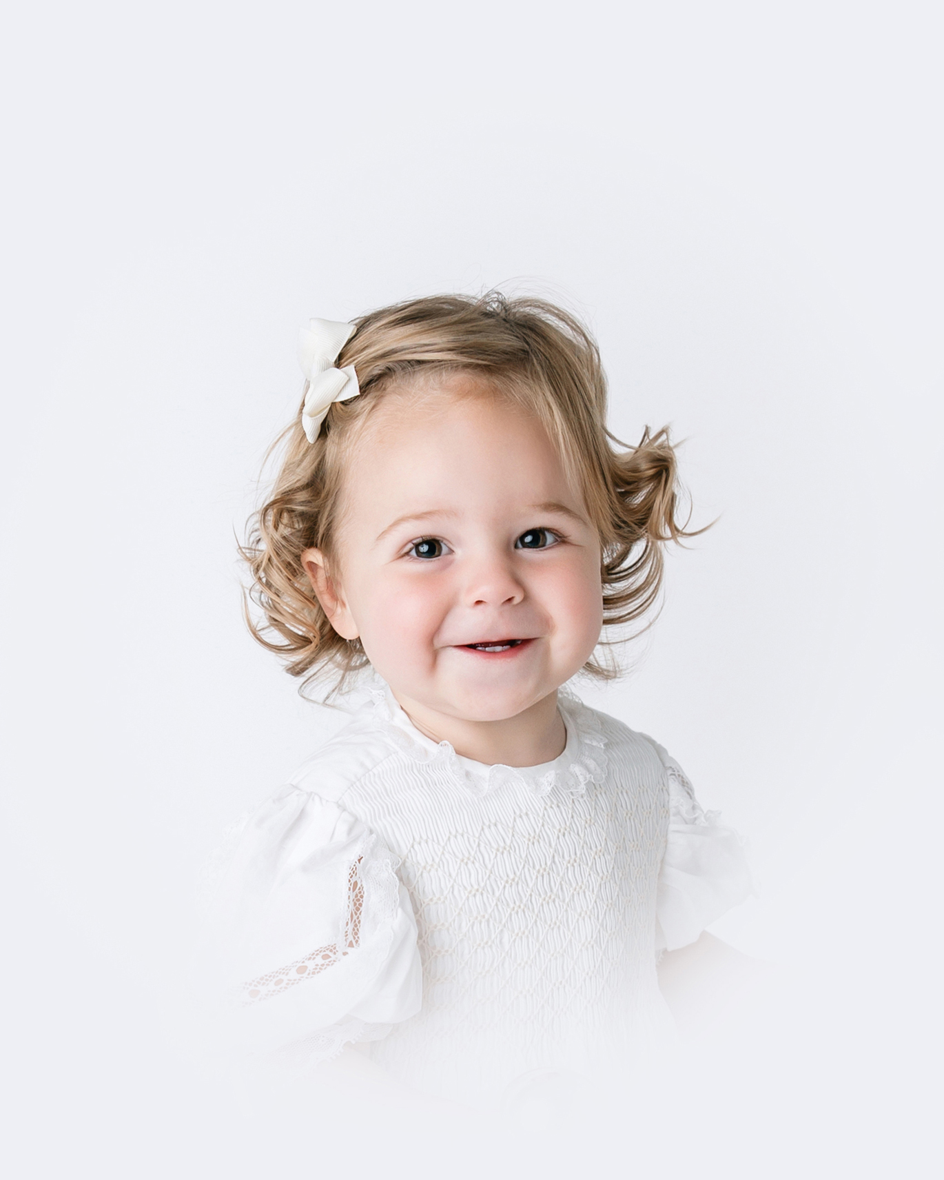 Timeless heirloom portraits of a child photographed in a classic studio style in Savannah, Georgia