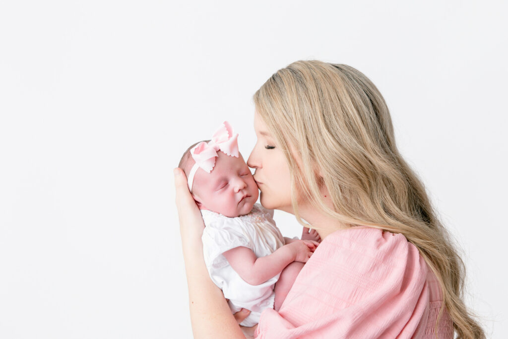 mom and baby during studio newborn session in savannah ga