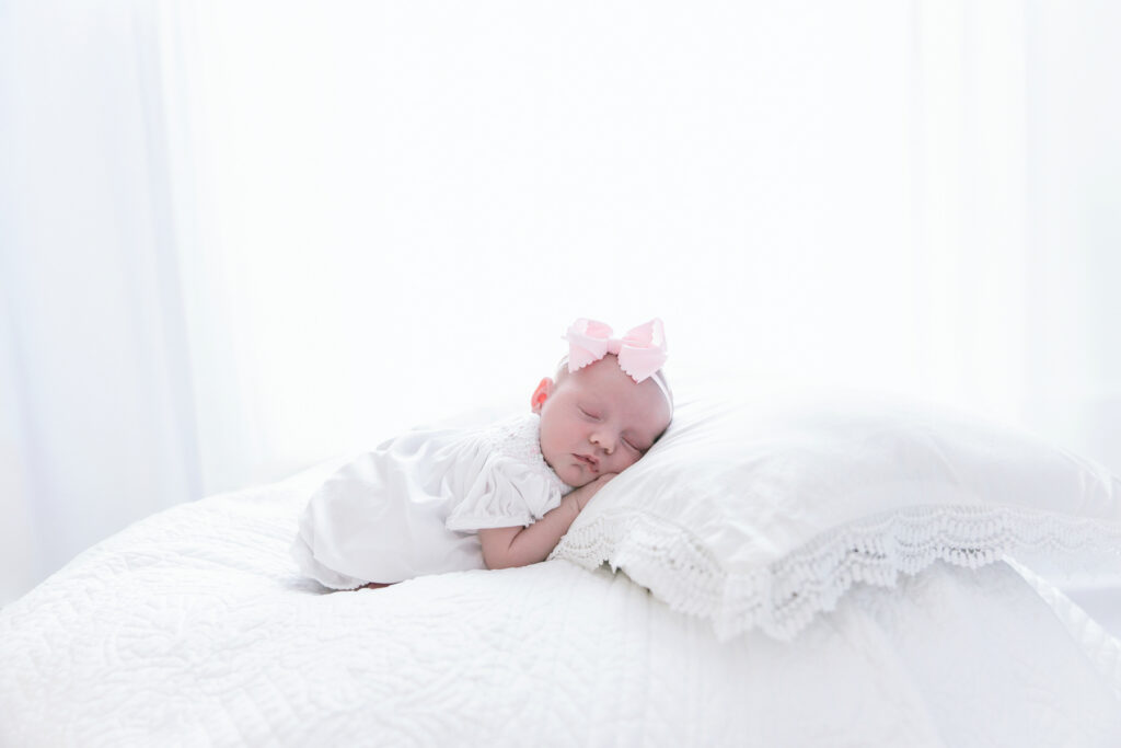 newborn baby posed on neutral backdrop in Savannah Georgia photography studio