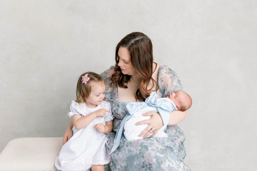 Mom and children during newborn photos in Savannah