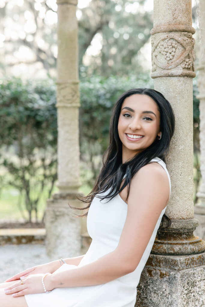 College senior girl smiling during senior portrait session in Richmond Hill