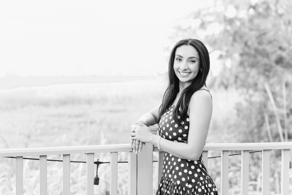 Black and white image of senior taken during portrait session with Tiffany Bradley Photography