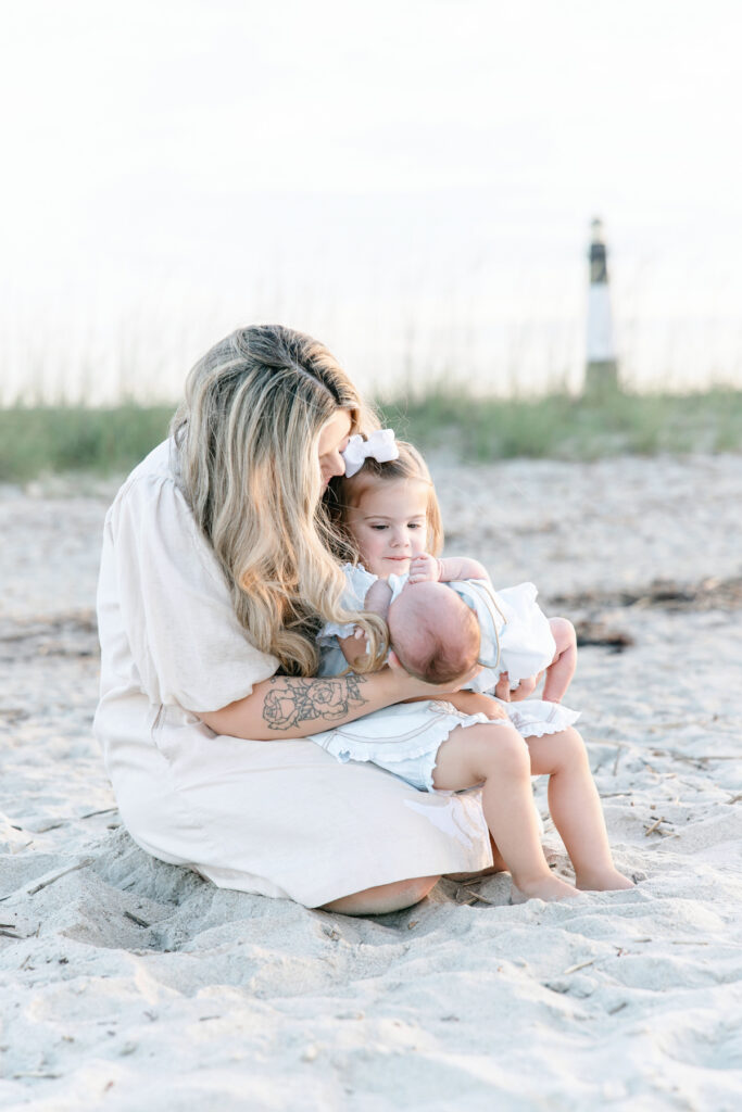 Mom and her two children in front of Tybee Island Lighthouse