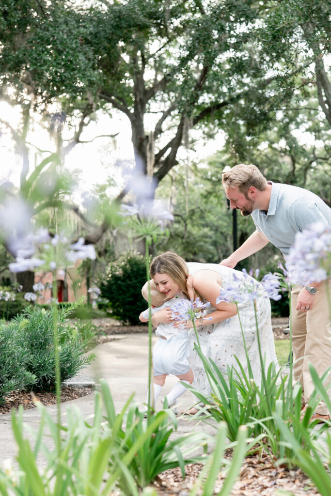 Joyful family moment during an outdoor portrait session in Savannah 