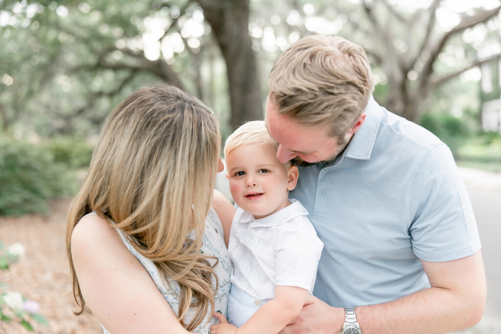 Mom and dad looking at their little boy during Savannah, GA photo session