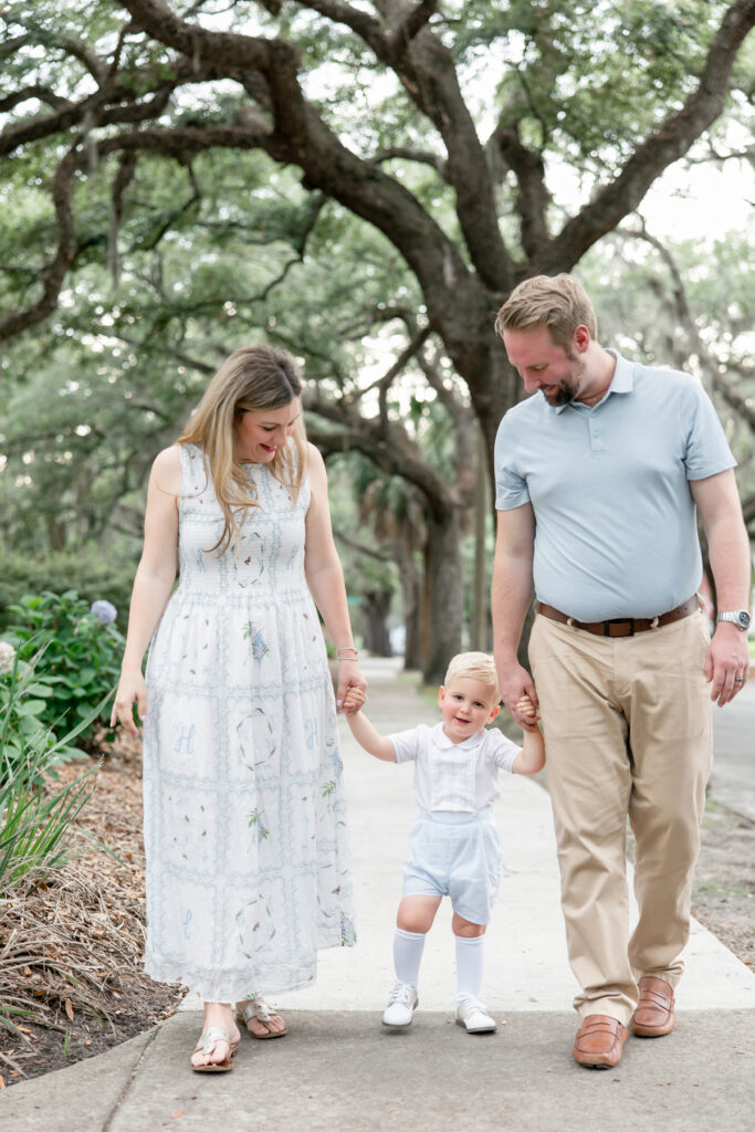 Family of 3 walking through historic Savannah park