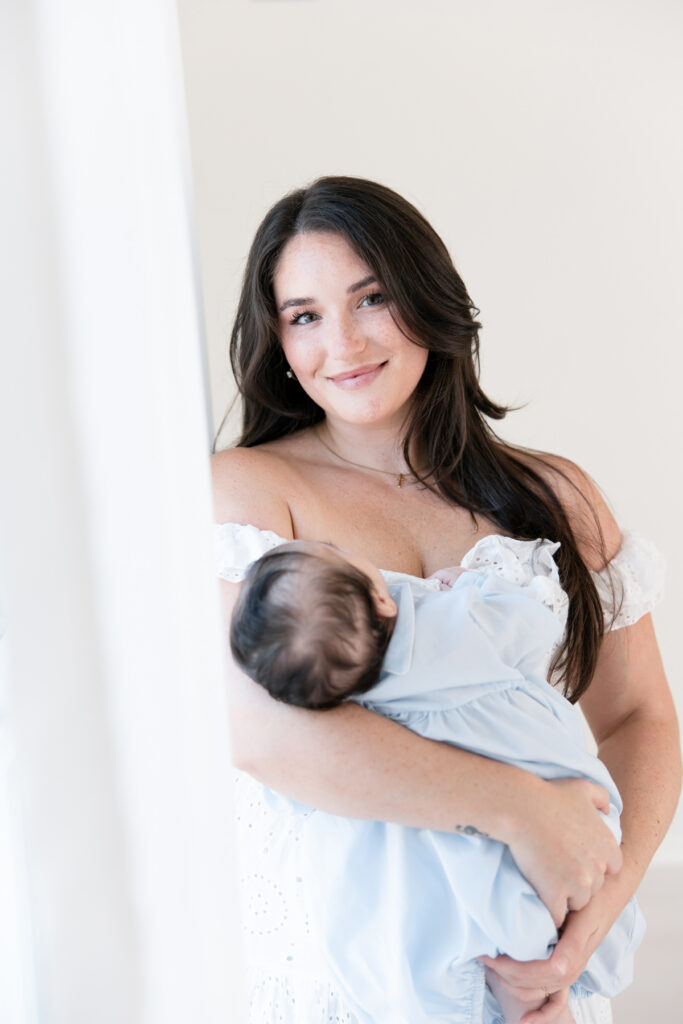 Mother cradling her baby boy in soft natural light